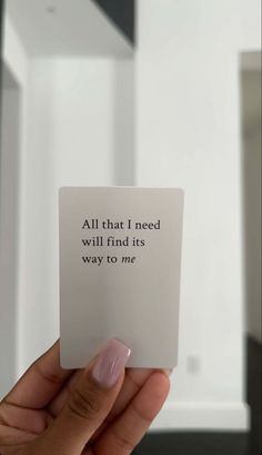 someone holding up a card that says, all that i need will find its way to me