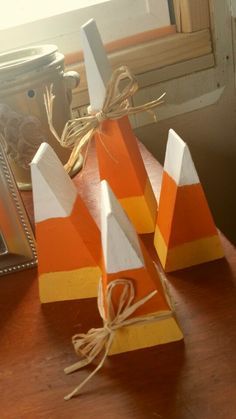 three wooden blocks are sitting on a table