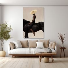 a woman sitting on top of a black horse in a living room with white walls