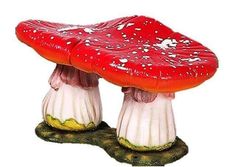 two red and white mushrooms sitting on top of each other