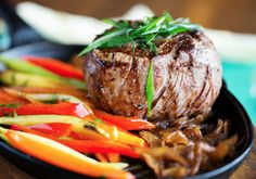 steak and vegetables in a cast iron skillet