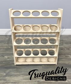 a wooden shelf with circles on it and the words frugaility designs above it