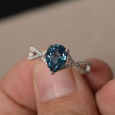 This is a gorgeous handmade creation. Its beauty is its simplicity & Elegance. The 7*9 mm pear shape faceted London Blue Topaz is crafted in solid sterling silver and with rhodium plated. All item is sent in a beautiful gift box If you have any idea of design your ring,pls contact me directly. You can realize more lovely stuff clicking the link https://www.etsy.com/shop/knightjewelry?refshopsection_shophome_leftnav Please leave the correct address and you phone number for delivering successf Cheap Blue Round Midi Rings, Topaz Rings, Blue Gemstone Ring, Blue Gemstone Rings, Cute Engagement Rings, London Blue Topaz Ring, Magical Jewelry, Birthday Ring, Ring Collection