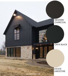 the exterior of a modern home with black and white paint, stone walls, and windows