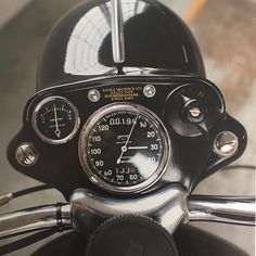 the speedometer is visible on this motorcycle's handlebars and back end