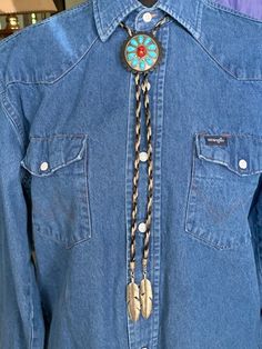 Women's or men's bolo tie made of high quality black and silver horse horse hair round braid with silver feather tips.  The slide is an oval-shaped garnet and turquoise western concho on a black leather rosette. There is a black magnetic clasp at the top to for ease of application. Diy Bolo Ties, Contra Dancing, Bolo Tie Men, Round Braid, Turquoise Western, Horse Horse, Bolo Ties, Silver Horse, Silver Feather