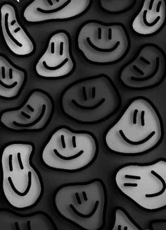 an abstract black and white photo with smiley faces