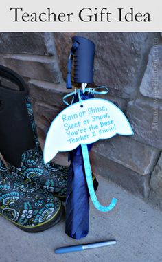 a pair of boots with a blue tie tied to them and a sign that says teacher gift idea