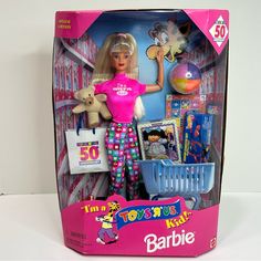 a barbie doll in a toy store display case