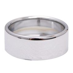 a white gold wedding ring on a white background