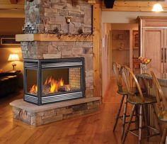 a living room filled with furniture and a fire place