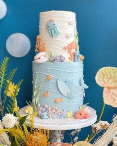 a three tiered cake decorated with sea life