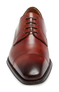 Burnished, water-resistant leather defines a handsome derby built with an arch-support footbed for exceptional comfort.Runs large; order 1/2 size down. Lace-up style Cushioned footbed Leather upper and lining/synthetic sole Made in Portugal Men's Shoes Fitted Dress Shoes With Leather Footbed For Derby, Fitted Dress Shoes With Removable Insole For Derby, Fitted Brown Oxfords With Removable Insole, Fitted Leather Derby With Plain Toe, Classic Fitted Dress Shoes With Cushioned Footbed, Up Styles, Arch Support, Cognac, Nordstrom Rack