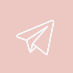 a white paper airplane on a pink background