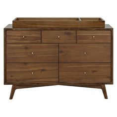 The Palma 7-drawer double dresser is a sophisticated mid-century-inspired design with tapered legs, brushed metal hardware, and smooth-glide drawers. It's a versatile modern piece, providing ample storage space with three top drawers and four larger bottom drawers. Color: Natural Walnut babyletto Palma 7 Drawer 53" W Double Dresser in Brown/Yellow | Size 34.25 H x 53.0 W x 19.0 D in | AllModern Babyletto Palma, Elegant Nursery, Play Wood, Bed Bassinet