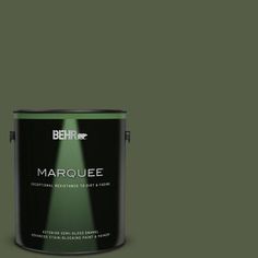 the behr marquee paint is shown in dark green and has a black base