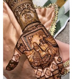 a woman's hand decorated with henna