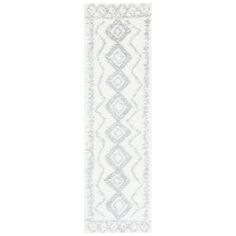 a white and grey rug with an intricate design on the bottom, in front of a white background