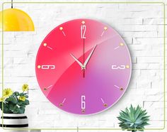 a large clock on the wall next to a potted plant and yellow light bulb