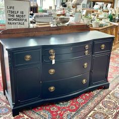 an antique dresser is on display in a store