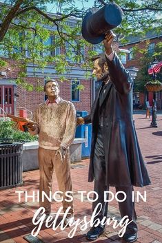 two statues with the words things to do in geldisburg