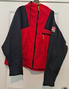 Marlboro Unlimited zip front windbreaker red and black jacket adult size large with adjustable hoodie.  The jacket has 3 front zippered pockets. There is a patch on the left arm. The jacket has some stains throughout on the inside and on the outside of the jacket. Approximate jacket measurements: - Shoulder to shoulder: ~24 inches - Shoulder to bottom: ~26 inches - Pit to pit: ~26 inches - Sleeve length (shoulder to wrist): ~27 inches Please see ALL  pictures and feel free to ask questions. Red Long Sleeve Hooded Jacket For Outdoor Activities, Red Hooded Track Jacket For Outdoor Activities, Red Hooded Jacket For Outdoor Activities, Urban Red Hooded Jacket With Double-lined Hood, Red Urban Hooded Jacket With Double-lined Hood, Red Vintage Windbreaker For Winter, Red Hooded Windbreaker With Double-lined Hood, Vintage Hooded Track Jacket For Streetwear, Hooded Red Sport Coat For Winter