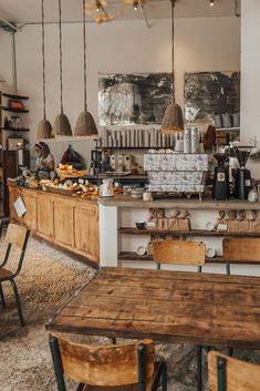 a coffee shop with wooden tables and chairs