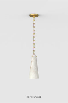 a light fixture with a chain hanging from it's side and an object in the middle