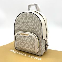 Brand New With Tag Michael Kors Jaycee Xs Mini Convertible Zip Pocket Backpack Crossbody Pvc Leather Mk Signature Color: Light Cream Multi Gold Tone Hardware Michael Kors Logo On Front 1 Zip Pocket At Front Zip Top Closure Custom Fabric Lining 2 Slip-In Pockets 7" (L) X 9' (H) X 3' (D) 2" Top Handle & Adjustable Backpack Straps Modern White Bags With Logo, White Backpack With Logo, Everyday White Backpack With Logo, White Logo Backpack For Everyday Use, Everyday White Logo Backpack, White Logo Backpack, White Bags With Logo For Daily Use, White Luxury Bag With Zipper Closure, White Logo Bags For Daily Use