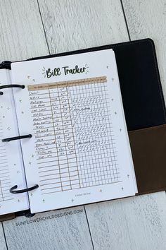 an open planner with the words bill tracker on it