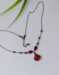 Minimalist Vintage style Necklace with  Faceted Red Garnet Glass Bead 15x13mm, Faceted Red Glass Oval beads 8 x 6 mm, Faceted Garnet Stones 4 mm, 3 mm and 2 mm. Sterling Silver oxidized chain.  Cosure has small Garnet stones. Oxidized Sterling Silver Spring Ring Clasp 5.5 mm. Your order will be wrapped and shipped in jewelry gift box.    If you would like to order this item as a gift you can leave a personalized note for the receiver during a checkout process, there will be an option to add a message. Please enter my shop here - www.etsy.com/shop/ZarinaJewelry or my FB page www.facebook.com/ZarinaJewelry Elegant Wire Wrapped Necklaces For Valentine's Day, Dainty Red Necklace For Wedding, Birthday Gift For Daughter, Oxidised Silver Jewelry, Vintage Style Necklace, Minimalist Vintage, Goth Jewelry, Oval Beads, Gift For Daughter