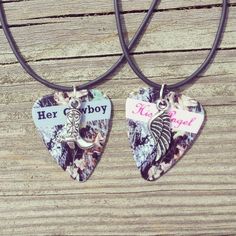 two heart shaped necklaces with the words her cowboy and her cowgirl on them