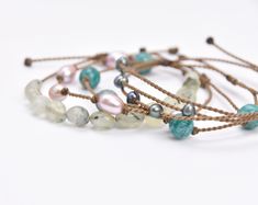 Our just-the-right-amount-of-dainty Tula Blue bracelets are your new everyday obsession. Wear your bracelets on their own for a minimalist moment, or as a stack for a bold statement. You’ll be saying, “Thanks— it’s Tula Blue!” all day long.Not sure where to start your Tula Blue bracelet stack? You’ve come to the right place. Sit back, relax, & let us stack for you! Shop our curated collection of tried & true bracelet stacks.This 'Crisp Morning Breeze' Bracelet Stack includes: 1. Peacock Freshwat Adjustable Bohemian Pearl Bracelet, Adjustable Modern Pearl Bracelet As Gift, Adjustable Modern Pearl Bracelet For Gift, Elegant Blue Bracelet With Adjustable Length, Modern Adjustable Stackable Bracelets, Adjustable Turquoise Pearl Bracelet Gift, Everyday Jewelry Bracelet With Adjustable Cord, Modern Everyday Bracelet With Adjustable Cord, Everyday Sliding Knot Bracelet