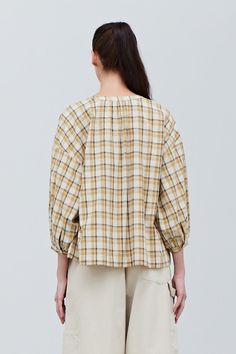 The Annelise Plaid Blouse is made from soft and comfortable cotton, this blouse features raglan sleeves for added movement, a round neckline for a classic look, and a shell button front closure for ease. The ivory, yellow, and taupe plaid is perfect for both casual and formal occasions, this blouse is a versatile addition to any wardrobe. Material100% CottonLightweight cotton lawnButton Front ClosurePearl buttonsEasy fitTrue to sizeWash cold, hang to dry Model FitMegan is wearing size MModel is Beige Cotton Daywear Blouse, Beige Cotton Blouse For Daywear, Relaxed Fit Plaid Blouse For Daywear, Plaid Blouse, Formal Occasion, Raglan Sleeve, Classic Looks, Round Neckline, Plaid