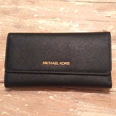 Nwt Michael Kors Black Saffiano Leather Large Jet Set Bifold Travel Wallet $278. Never Used. Measures Just Over 7in Long X 4in Tall X 3/4in Deep. Travel Wallets With Gold-tone Hardware, Elegant Saffiano Leather Wallet With Card Slots, Classic Everyday Wallet With Gold-tone Hardware, Black Wallet With Gold-tone Hardware For Everyday Use, Classic Wallet With Gold-tone Hardware, Classic Everyday Wallets With Gold-tone Hardware, Black Saffiano Leather Wallet For Everyday Use, Classic Saffiano Leather Travel Wallet, Black Wallets With Gold-tone Hardware