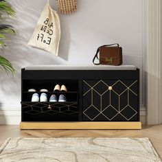 a black and gold cabinet with shoes on it