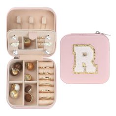 a pink jewelry case filled with lots of rings