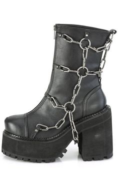 The ultimate biker boots! A harness of chunky chains and o rings flank these boots, a step up on yer regular punk kicks! Black PU Vegan 4 3/4 inch heel 2 1/4 inch platform Rear Zip Chain decals. Ankle boots U.S women's sizing-refer to size chart for more info Edgy Chain Boots For Streetwear, Punk Style Chain Boots For Streetwear, Chain Boots, Demonia Boots, Demonia Shoes, Black Vegan, Platform Ankle Boots, Biker Boots, 4 Inch Heels