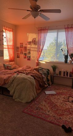 a bed room with a neatly made bed and a rug on the floor next to it