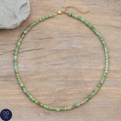 This delicate adjustable necklace makes a wonderful gift for yourself, friend or loved one.            Green Grass jasper beaded necklace with golden plated spacer beads , Natural Stones , Adjustable . Boho style      Jade size ; 2X4mm      Size :: Around 16 inches   Green jasper is the healing stone for Relaxation, bringing calm and being ideal for those who are emotionally stressed.        Please note: All natural stone will have slight color difference. Each stone is unique in its color varia Green Heishi Beads Necklace For Gift, Dainty Hand-strung Necklaces For Gifts, Dainty Hand-strung Necklace As A Gift, Dainty Hand-strung Necklace For Gift, Dainty Hand-strung Beaded Necklace As Gift, Hand-strung Heishi Bead Necklaces As Gifts, Hand-strung Heishi Bead Necklaces For Gifts, Hand-strung Heishi Bead Necklace For Gift, Spiritual Heishi Bead Necklace For Gift