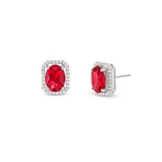 Elevate your day or nighttime looks with these alluring lab-created ruby and diamond stud earrings. 10K white gold Each earring features an 8.0 x 6.0mm oval-shaped red lab-created ruby Diamonds line the open octagonal frame 1/6 ct. t.w. of diamonds Friction backs Red Pave Setting Jewelry For Formal Occasions, Red Jewelry With Pave Setting For Formal Occasions, Red Formal Jewelry With Pave Setting, Classic Red Jewelry With Pave Setting, Red Cubic Zirconia Classic Diamond Earrings, Silver Earrings With Prong Setting And Lab-created Ruby, Red Lab, Ruby Earrings, Diamond Stud Earrings