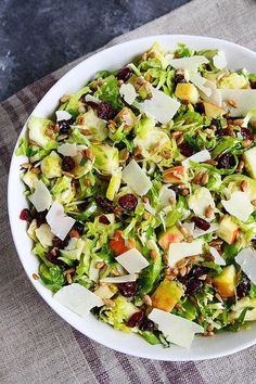 a white bowl filled with salad on top of a table