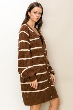 Stay comfy and stylish with the HYFVE Made for Style Oversized Striped Sweater Cardigan. This cardigan has a longline silhouette, oversized fit, and cozy long sleeves, providing an extra dose of warmth while giving you an on-trend look. The button-front style also adds a classic touch, allowing you to easily layer it over your winter wardrobe. Model is wearing a smallModel SpecsHeight: 5'7"Bust: 32"Waist: 25"Hips: 35" Imported. Designed in the USA Made for Style Oversized Striped Sweater Cardiga Oversized Striped Sweater, Oversized Sweater Cardigan, Cardigan Oversized, Longline Cardigan, Cardigan Long, Cozy Fits, Oversized Cardigan, Oversized Silhouette, Striped Cardigan