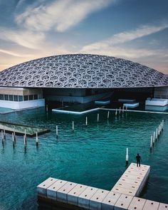 a large building sitting on top of a body of water