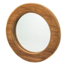 a round wooden mirror on a white background