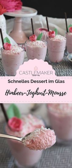 some desserts in glasses with pink frosting and flowers on the top are ready to be eaten