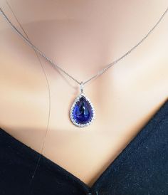 15.43 Carat Tanzanite and Diamond Pendant Necklace in 18 Karat White Gold For Sale at 1stDibs Formal Hallmarked Teardrop Necklace, Timeless Teardrop Pendant Drop Necklace For Formal Occasions, Fine Jewelry Pear-shaped Drop Necklace For Formal Events, Formal Teardrop Pendant Drop Necklace, Timeless Teardrop Drop Necklace For Formal Occasions, Luxury Tanzanite Pear-shaped Jewelry, Luxury Pear-shaped Tanzanite Jewelry, Formal Sapphire Teardrop Pendant Necklace, Elegant Sapphire Teardrop Necklace