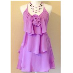 New Gorgeous C Style Lavender Spaghetti Strap Layered Flounce Dress W/A Removable Rosette On The Halter Look Front Thatties Behind Neck W/A Deep Open V-Back. The Ties Are Adjustable Allowing You To Wear This Higher Or Lower Or To Accommodate Your Shape. Can Be Worn As A Above Knee Or A Mini Dress. Fully Lined, Side Zip. Color= Pink Toned Lavender. - Sz M. Runs A Bit Big. Can Fit A Sz M To Lrg Dep How You Like Your Fit To Be. This Will Fit Different Depending On Your Body Shape & Bust Size. This Sleeveless Mauve Mini Dress With Ruffles, Lavender Sleeveless Mini Dress With Ruffles, Mauve Mini Dress With Ruffles Sleeveless, Lavender Flowy Sleeveless Dress, Purple Spaghetti Strap Sundress, Sleeveless Boho Dress, Back Tie Dress, Boho Sleeveless Dress, Fashion Feminine