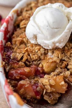 a close up of a plate of food with fruit and ice cream on top,