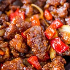 meat and vegetables are mixed together in a dish with sauce on top, ready to be eaten